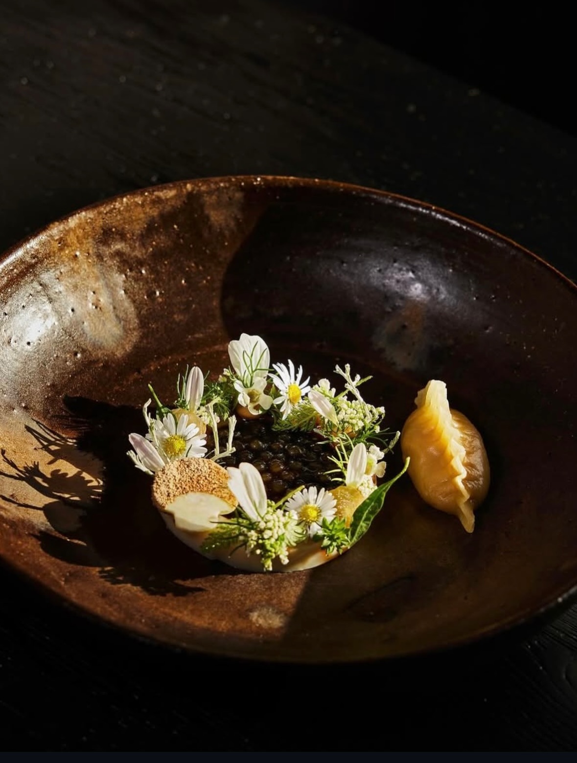 A dish decorated with flowers at Seven Swans
